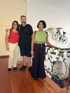 a group of three people posing for a picture at Av Paulista GF in São Paulo