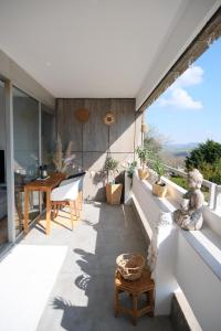 a balcony of a house with a table and chairs at Offline by Alexa in Lahnstein +28 photos