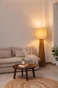 a living room with a couch and a table at Hotel PI Arte Exclusive Suite in Palermo