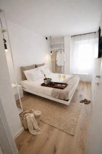 a bedroom with a bed with a tray of food on it at Residenza Ximenes in Palermo