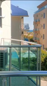 a balcony with a view of a building at Apartment in Primorsko Del Sol in Primorsko