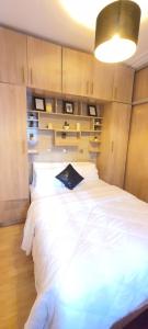 a bedroom with a bed with a book on it at Cozy appt in Casablanca +8 photos