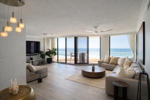 a living room with a view of the ocean at Albatross North Apartments in Gold Coast