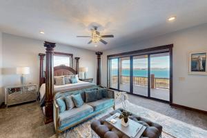 a bedroom with a bed and a couch at Raspberry Ridge Lodge in Fish Haven +72 photos