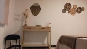 a room with a table and a mirror on the wall at Casa La Abuela 1982 in La Iruela