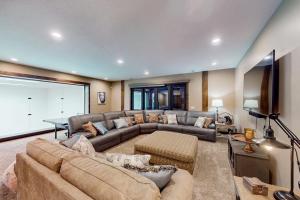 a large living room with a couch and a table at Raspberry Ridge Lodge in Fish Haven