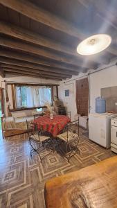 a living room with a table and a couch at Biocasa in Villa Anizacate