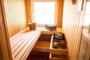 an inside view of a sauna with a window at Ferienhaus Hörli in Sankt Peterzell