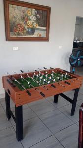 a large wooden foosball table with at Fruta mango # 1 in Playa Guacalillo