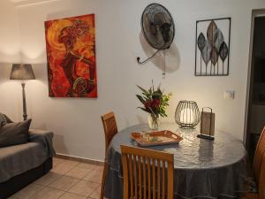 a living room with a table and a couch at Enjoy Studio in Pointe-Noire