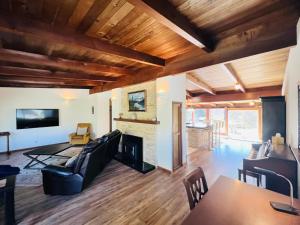 a living room with a couch and a fireplace at Vynmir BeachPark Villa in Fort Bragg