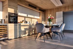 a kitchen with a table and chairs in a room at Villa Radman in Korčula