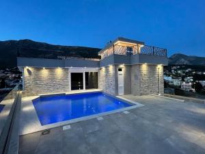 a house with a swimming pool on a roof at Lamadu Residence in Sutomore +62 photos