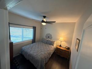 a bedroom with a bed and a ceiling fan at Albert Lea revival in Albert Lea
