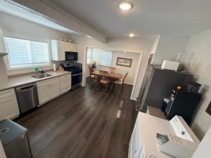 a kitchen with a sink and a table in it at Albert Lea revival in Albert Lea