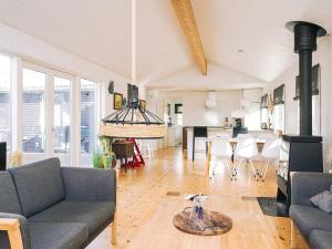 a living room with a couch and a table at 6 person holiday home in Grevinge-By Traum in Grevinge +23 photos