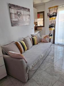 a couch sitting in a living room at Apartamento Retiro in Denia +33 photos