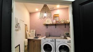 a laundry room with a washer and dryer at 12 Pearls in Cape May Point
