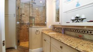 a bathroom with two sinks and a shower at 320 Knox Avenue, Cape May Point in Cape May Point +23 photos