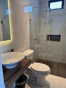 a bathroom with a toilet and a sink and a shower at Loft with Private Terrace in Tepic