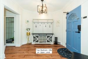 a living room with a fireplace and a blue door at 7811 The Solace Vista in Vancouver +53 photos