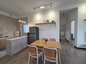 a kitchen and dining room with a table and chairs at MySky Putrajaya in Putrajaya