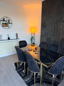 a dining room with a table and chairs at The Alcove Retreat in Bristol