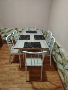 a dining room table with chairs and a quilt on it at Casa Rei in Vidolm +38 photos