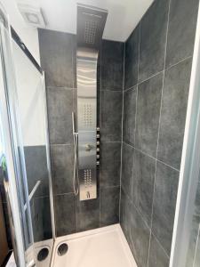 a shower with a glass door in a bathroom at The Alcove Retreat in Bristol +26 photos