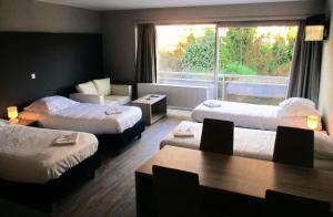 En eller flere senge i et værelse på Value Stay Residence Mechelen