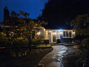 a house at night with lights on it at 7811 The Solace Vista in Vancouver