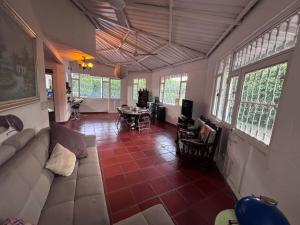 a living room with a couch and a table at Ricaurte casa campestre in Ricaurte