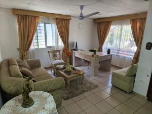 a living room with a couch and a table at Casa Aranza in Cartagena de Indias