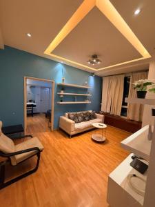 a living room with a couch and a table at Klcc Cozy Unit in Kuala Lumpur