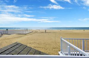 a view of the beach from the balcony of a house at Rooftop Deck with Stunning 360 Beach Views condo in Newport Beach +17 photos