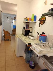a kitchen with a counter top with a sink at Casa Tortuga in Ixtapa