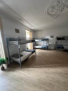 a room with three bunk beds in it at Varandas do Chiado - Coliving in Lisbon