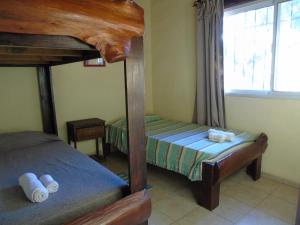 a bedroom with two bunk beds and a window at Cabañas Mandala in San Marcos Sierras +61 photos