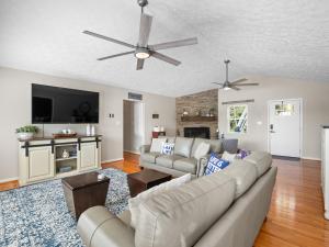 a living room with a couch and a ceiling fan at Sunset Cove - Large Cove, Gorgeous Sunsets, Amenities Galore! in Bremen
