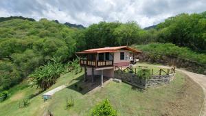 an overhead view of a small house on a hill at Mana Henua Lodge in Nuku Hiva +17 photos
