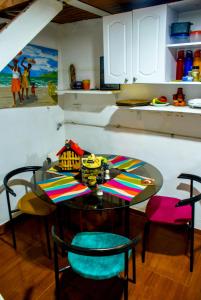 a table and chairs in a kitchen with a table and a dining room at Hospedaje Patty Cajicá in Cajicá +46 photos