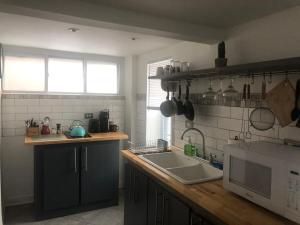 a kitchen with a sink and a counter top at Little haven by the woods in Peekskill