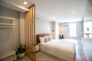 a small bedroom with a bed and a window at Siri Space สิริ สเปซ in Ban Khlong Nung (1) +27 photos