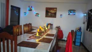 a dining room table with candles on top of it at Hostal Travesía Urbana in Guadalupe