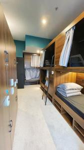 a small room with two bunk beds in it at Georgie Accommodation in Auckland +35 photos