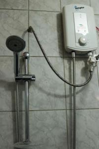a water heater on the wall of a bathroom at Lechugal Guest House in Cusco +83 photos