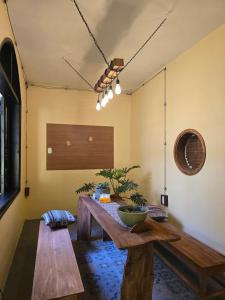 a living room with a wooden table in a room at a Hue Homestay in Hue