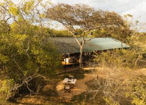 an overhead view of a house with a picnic table at Chena Wilds Wilpattu in Horuwila