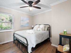 a bedroom with a bed with a ceiling fan at Sunset Cove - Large Cove, Gorgeous Sunsets, Amenities Galore! in Bremen