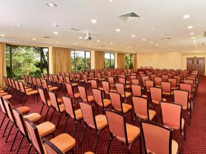 an empty room with rows of chairs in it at Hotel Quinta do Lago in Quinta do Lago +37 photos